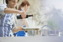 Couple cooking in kitchen — Stock Photo