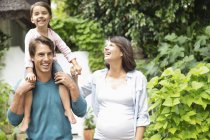 Family walking together outdoors — Stock Photo