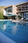 Modern house interior and swimming pool — Stock Photo