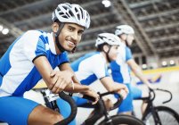 Track cycling team waiting in velodrome — Stock Photo