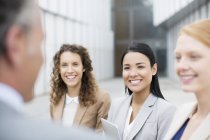 Smiling business people talking — Stock Photo