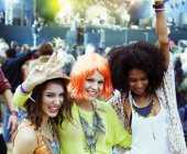 Portrait of cheering friends at music festival — Stock Photo