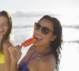 Portrait of happy woman enjoying flavored ice — Stock Photo