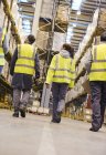 Workers walking in warehouse — Stock Photo