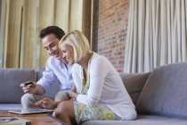 Couple shopping online with tablet computer — Stock Photo