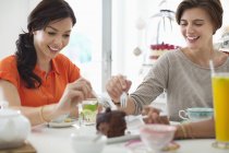 Women eating cake together — Stock Photo