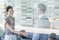 Business people shaking hands in office — Stock Photo
