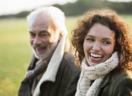 Father and adult daughter walking in park — Stock Photo