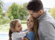 Happy family smiling together outdoors — Stock Photo