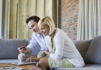Couple shopping online with tablet computer — Stock Photo