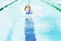 Swimmer racing in pool — Stock Photo