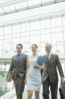Business people walking in office — Stock Photo