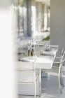 Set dining table on modern patio interior — Stock Photo
