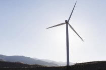 Silhouette of wind turbine in rural landscape — Stock Photo