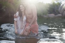 Friends wading in river during daytime — Stock Photo