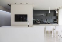Sink and breakfast bar in modern kitchen — Stock Photo