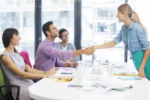 Business people shaking hands in meeting — Stock Photo