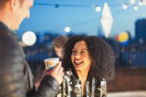 Young woman enjoying rooftop party — Stock Photo