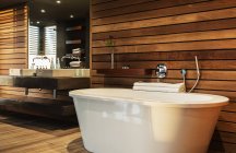 Bathtub and sink in modern bathroom — Stock Photo