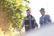 Father and adult son with fishing rods — Stock Photo