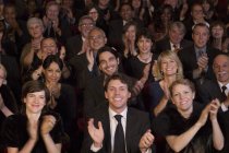Clapping theater audience indoors — Stock Photo