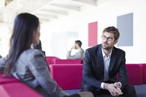 Successful adult business people talking in office — Stock Photo