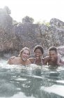 Friends laughing in river during daytime — Stock Photo