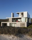 Modern house on beach — Stock Photo