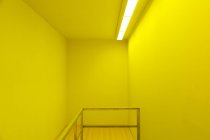 Banister in yellow room — Stock Photo