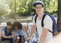Portrait smiling man with eyeglasses in park — Stock Photo
