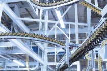 Winding printing press conveyor belts overhead — Stock Photo