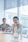 Businesswoman smiling in conference room — Stock Photo