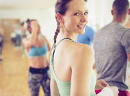 Portrait smiling woman in exercise class — Stock Photo