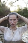 Portrait of woman in river during daytime — Stock Photo