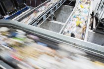 Blurred view of conveyor belts in recycling center — Stock Photo