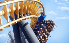 People riding amusement park ride — Stock Photo