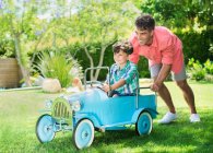 Father and son playing in backyard — Stock Photo