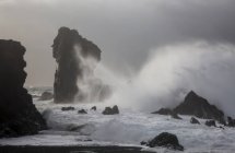 Ocean waves crashing against rock formations, Londrangar, Snaefellsnes, Iceland — Stock Photo
