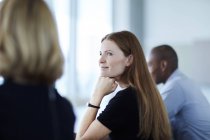 Confident businesswoman listening in meeting — Stock Photo