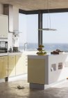 Интерьер современной кухни с видом на океан — стоковое фото