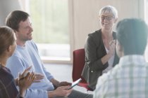 Smiling business people talking in meeting — Stock Photo