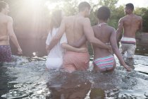 Friends wading in river during daytime — Stock Photo
