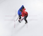 Overhead view hockey opponents colliding — Stock Photo