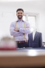Portrait confident tailor in menswear shop — Stock Photo