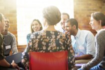 People laughing in group therapy session — Stock Photo