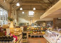 Market with brick walls and wood beam vaulted ceiling — Stock Photo