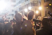 Paparazzi photographing celebrity at event — Stock Photo