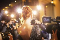 Celebrity being photographed by paparazzi photographers at event — Stock Photo