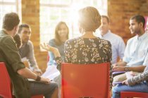 Woman speaking in group therapy session — Stock Photo