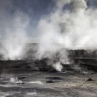 Steaming craters on rocky surface — Stock Photo